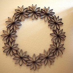 paper flower wreath hanging on wall