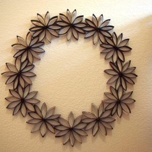 paper flower wreath hanging on wall