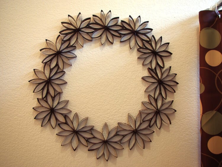 paper flower wreath hanging on wall 