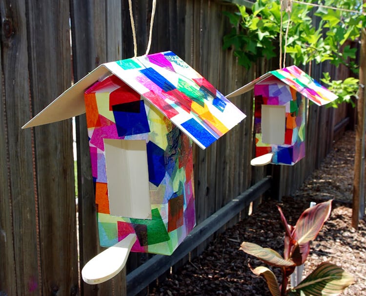 recycled carton bird houses hanging in yard