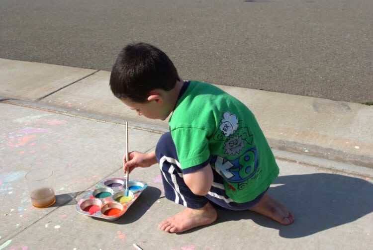 child painting with easy to make sidewalk paint