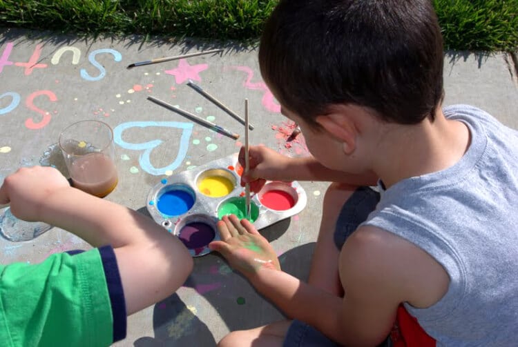 washable sidewalk chalk paint being played with outside