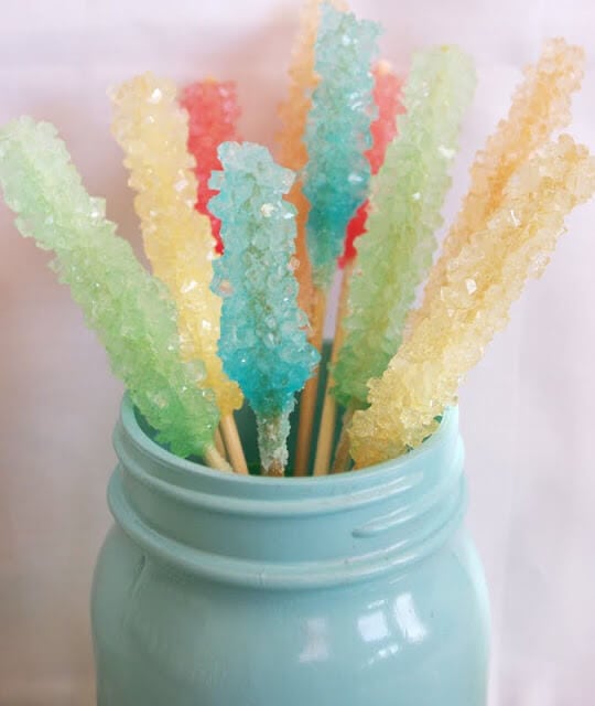 homemade rock candy on sticks in mason jar