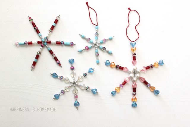 Christmas Craft for Kids: Colorful Beaded Snowflake Ornaments on a white background