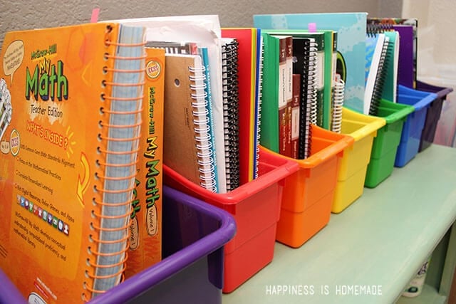 books and binders organized in slots