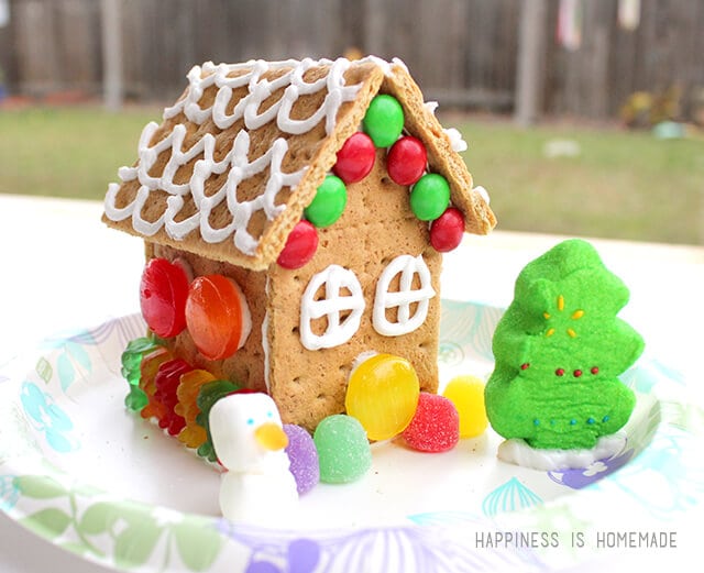 decorated gingerbread house with peep christmas tree