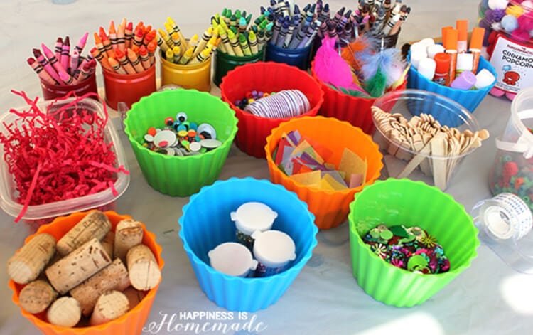 art party supplies in cups and organizers