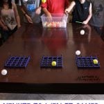 children playing pin pong tic tac toe minute to win it game