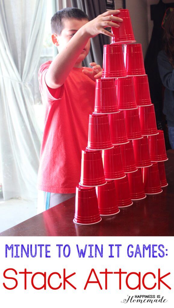 Minute to Win It Games: Stack Attack, shows small boy stacking red cups
