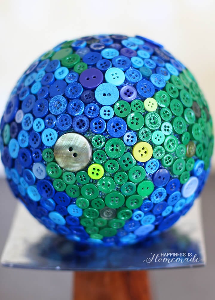 button covered earth globe