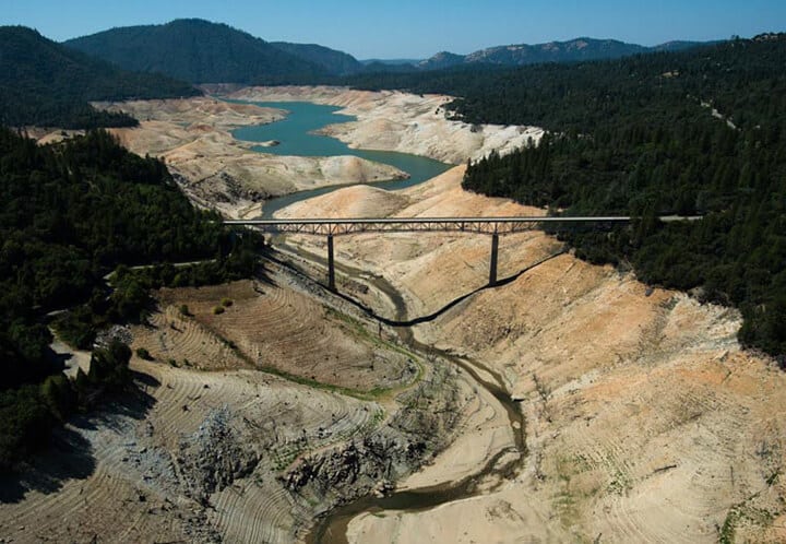 sky view of lake oroville during a drought showing very little water present 