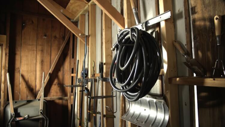 tools and hoses organized in tool shed