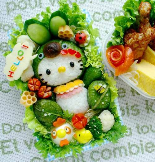 adorable bento box lunch idea for kids featuring a hello kitty face and cute characters