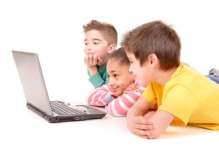 kids focused on computer screen 