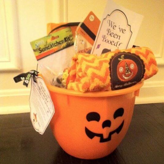 orange pumpkin halloween basket filled with goodies