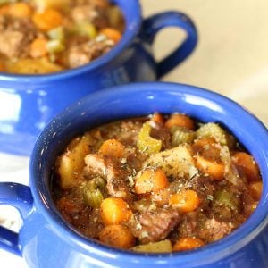 rustic crockpot slow cooked beef stew in pots