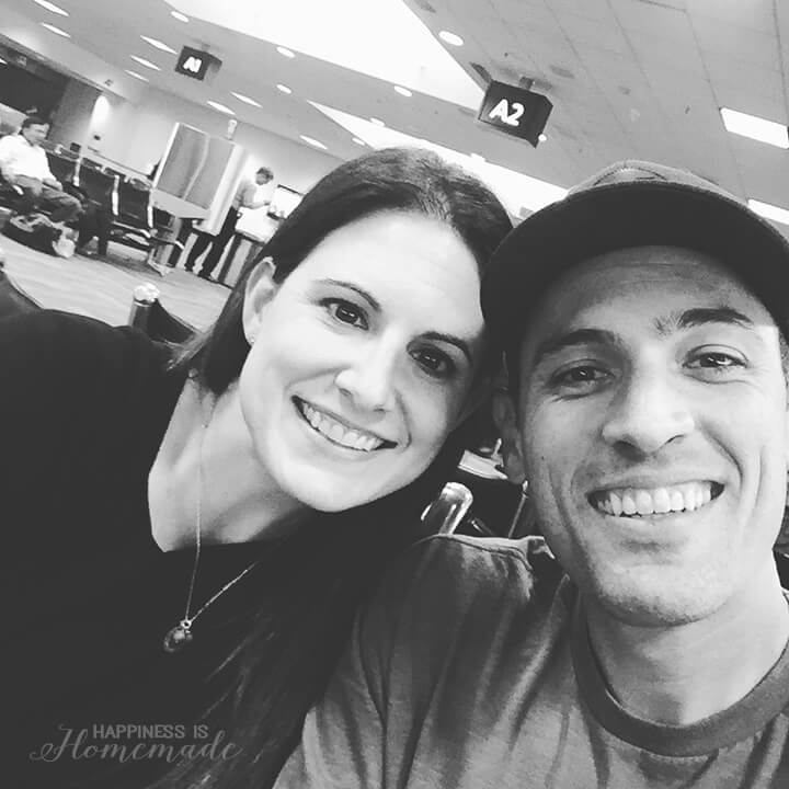 heidi and mitch inside of airport taking photo together