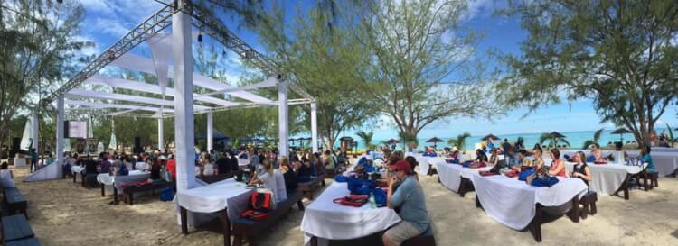 people outdoors seated at a conference