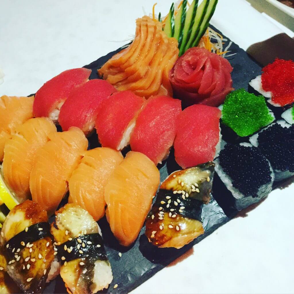 yummy sushi rolls on plate