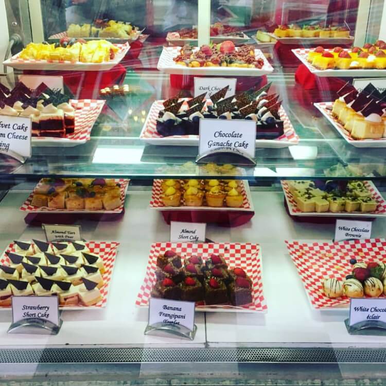 bakery display shelves full of yummy baked goods for sale