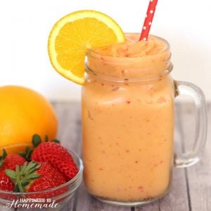 coldbuster immunity boosting smoothie in cup with straw and fresh fruit