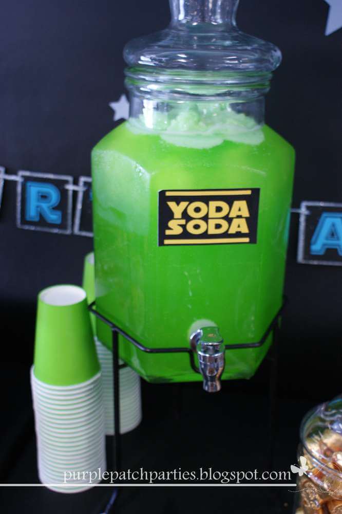 yoda soda pitcher full of green juce with cups