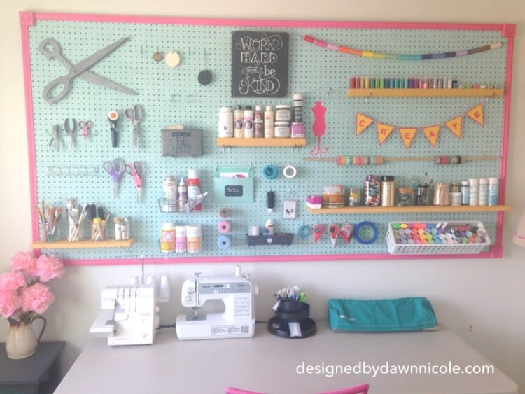 giant craft room pegboard filled with craft supplies