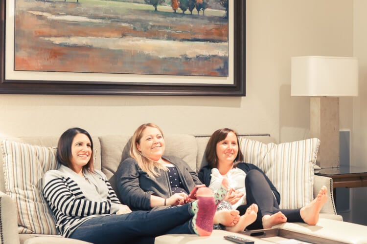 ladies on couch enjoying living area