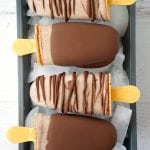 caramel chocolate nut popsicles on ice