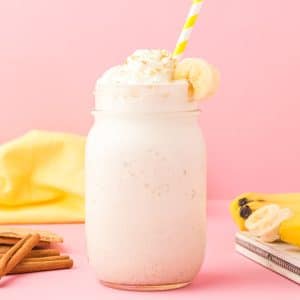 healthy banana cream pie smoothie on pink background