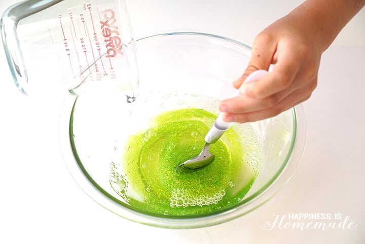 mixing up diy slime recipe in bowl