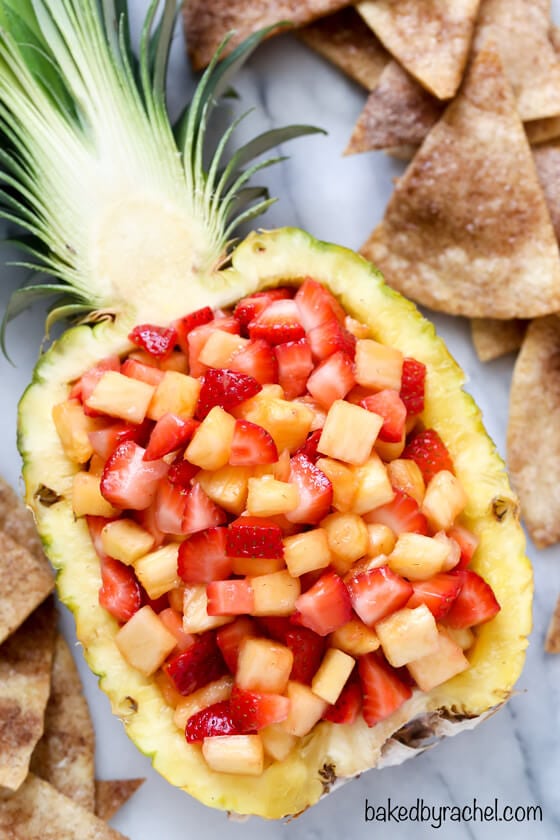 strawberry and pineapple chunks filling halved pineapple