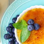 creme brulee garnished with blueberries