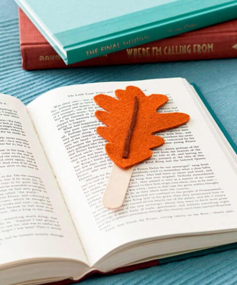 leaf bookmark made from felt and a craft stick on open book