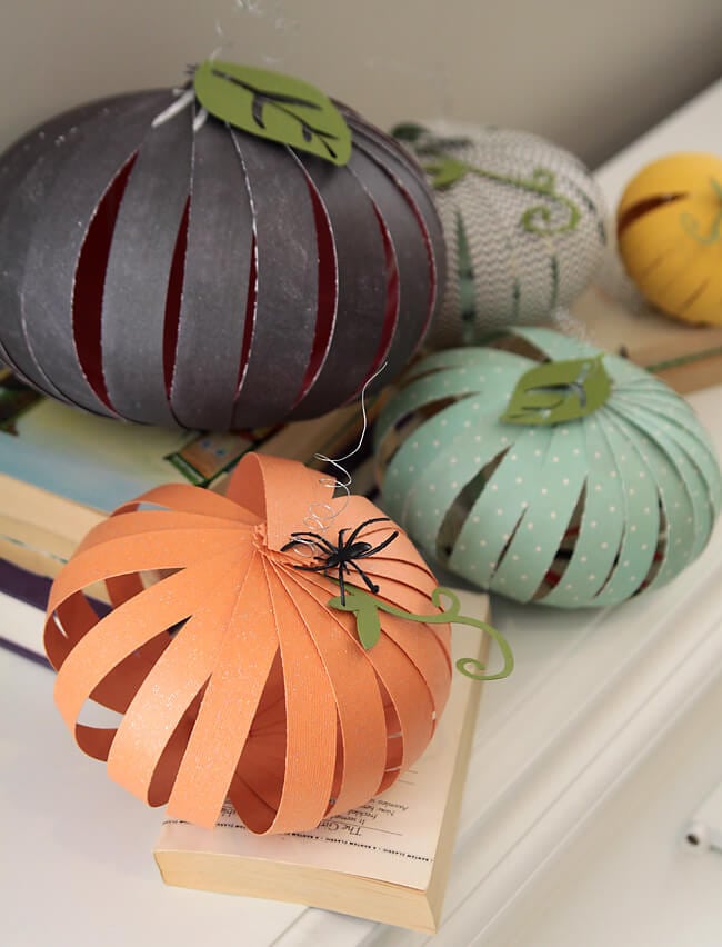 strips of paper made into different color fall pumpkins