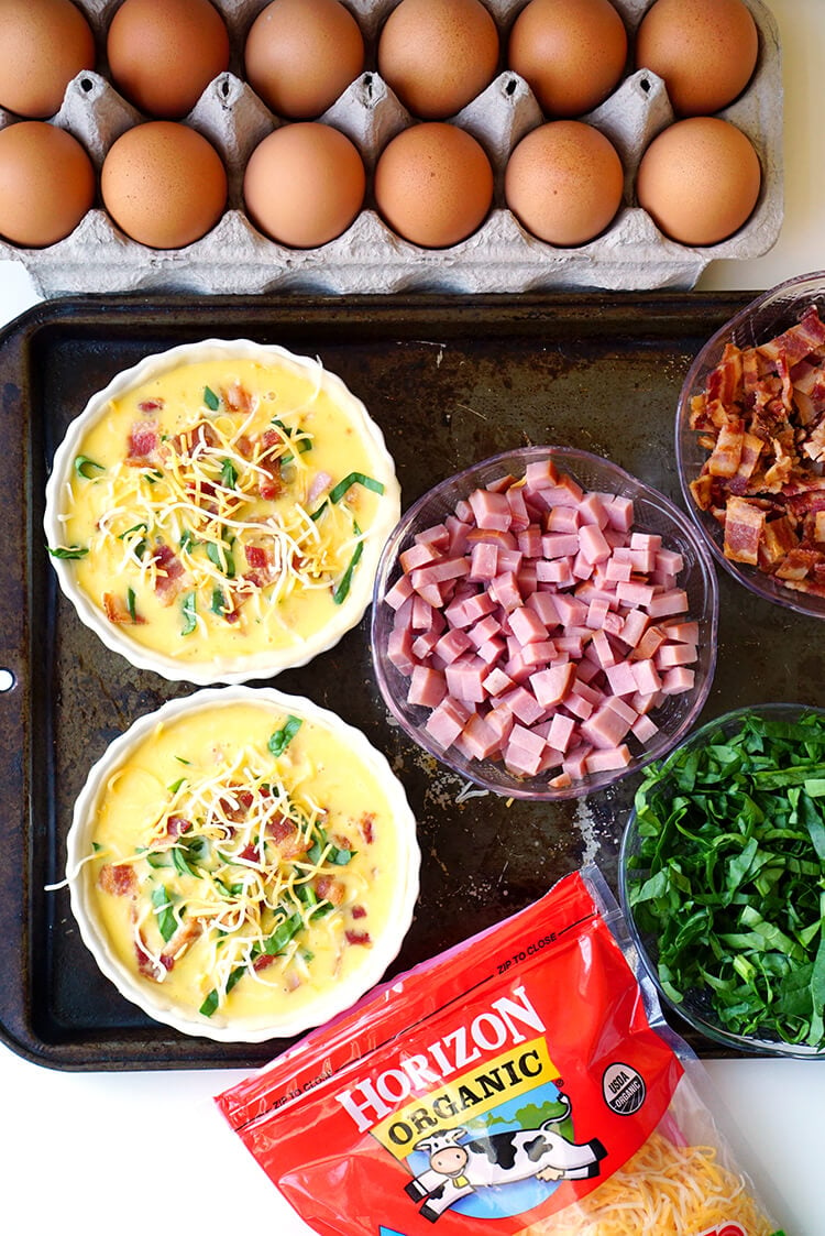customizable quiches with bowls of healthy ingredients