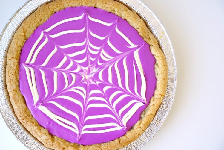 spiraled icing pulled into webbing on cookie pizza