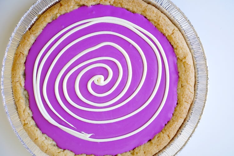 white icing spiraled around the top of cookie 