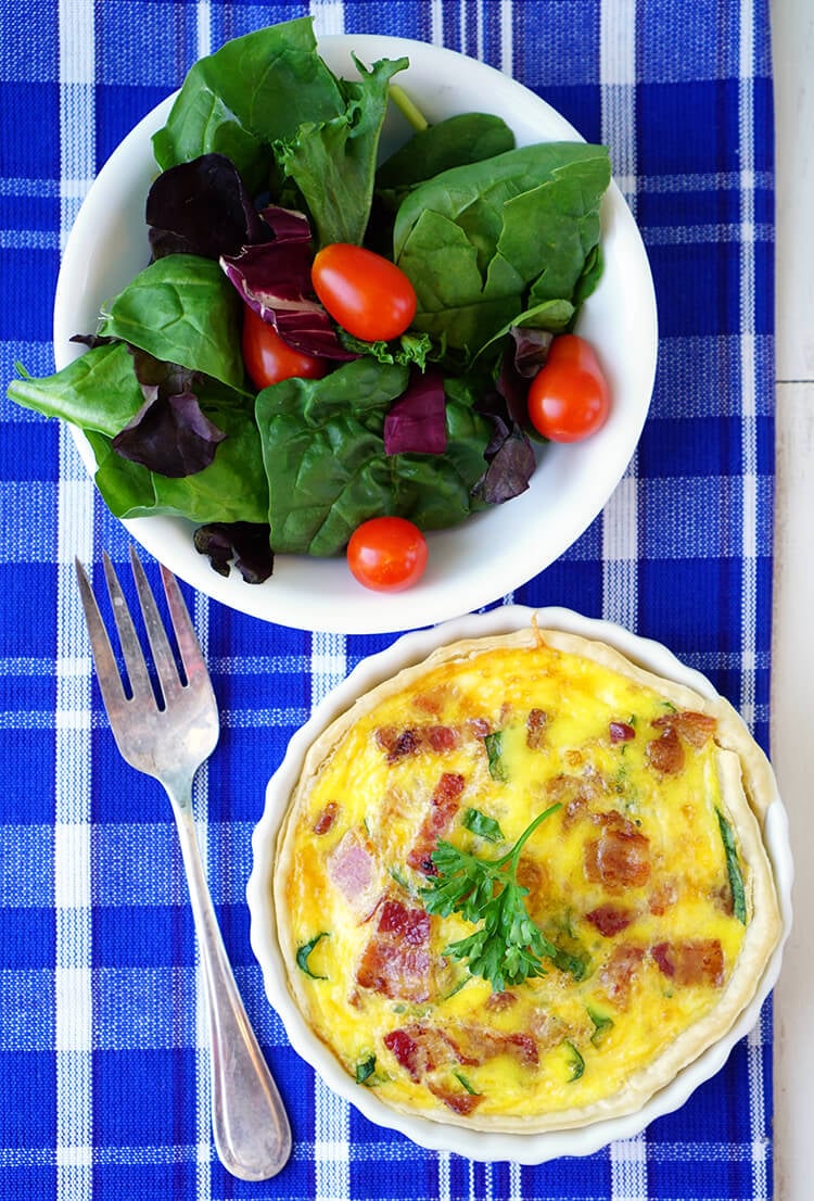 easy to make breakfast quiche bowl and side salad with fork
