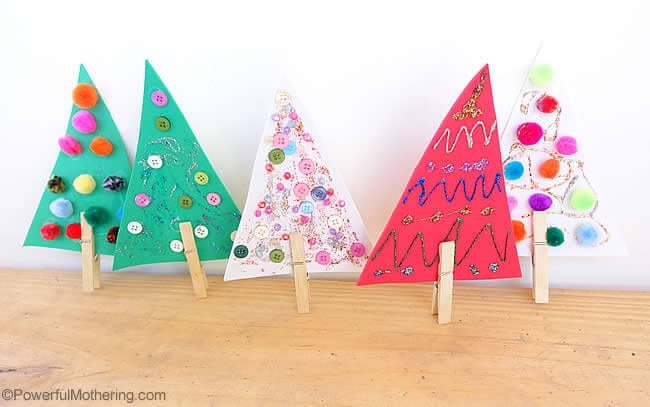 mini christmas trees made from paper and a clothespin