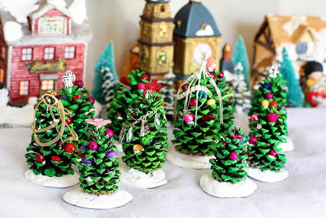 pine cone trees with christmas village scene
