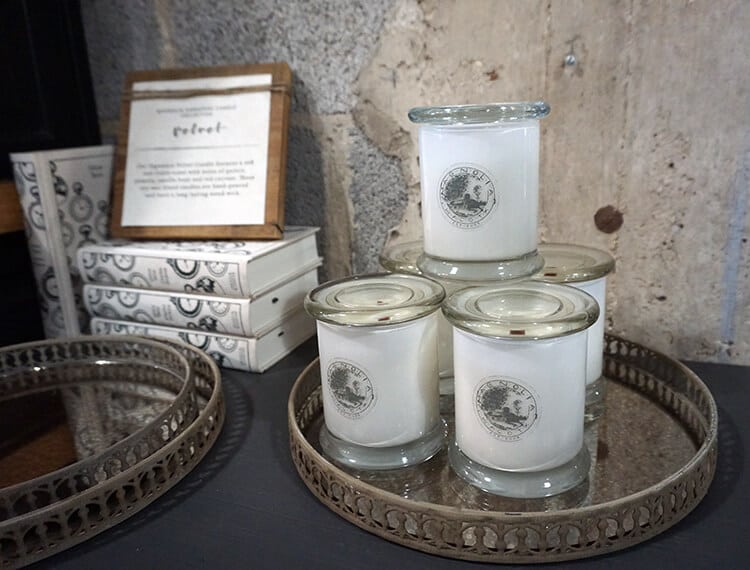 magnolia market shopping candle and book displays