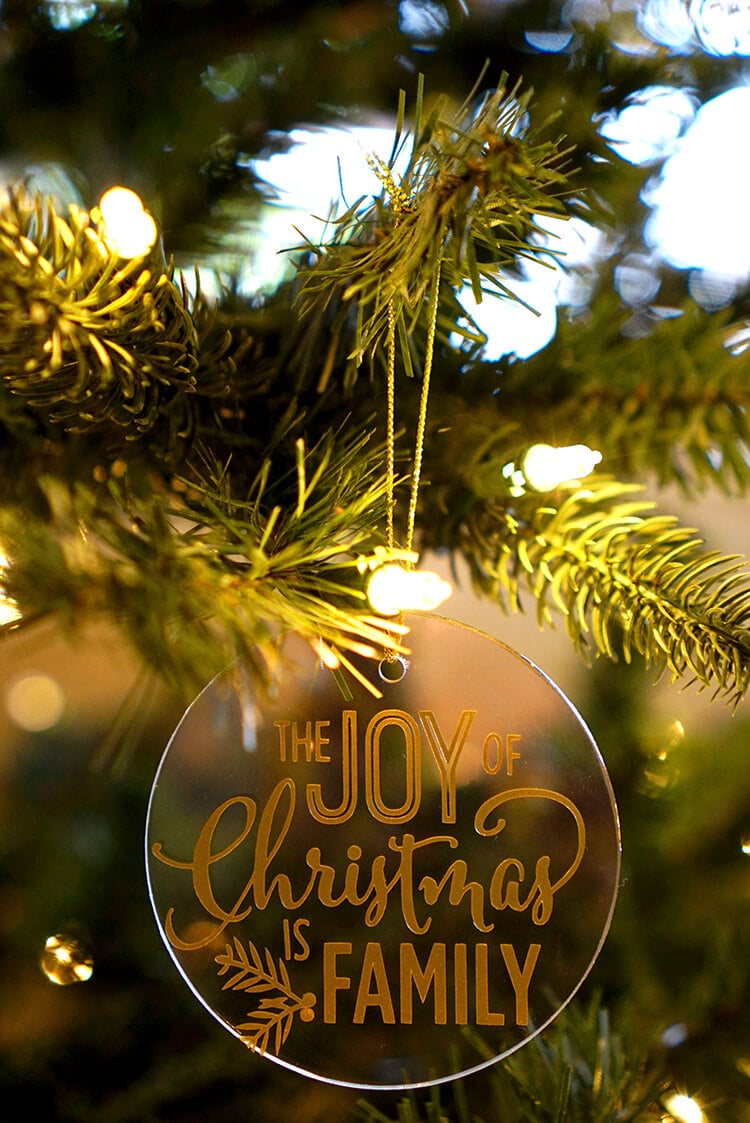 glass vinyl ornament that reads the joy of christmas