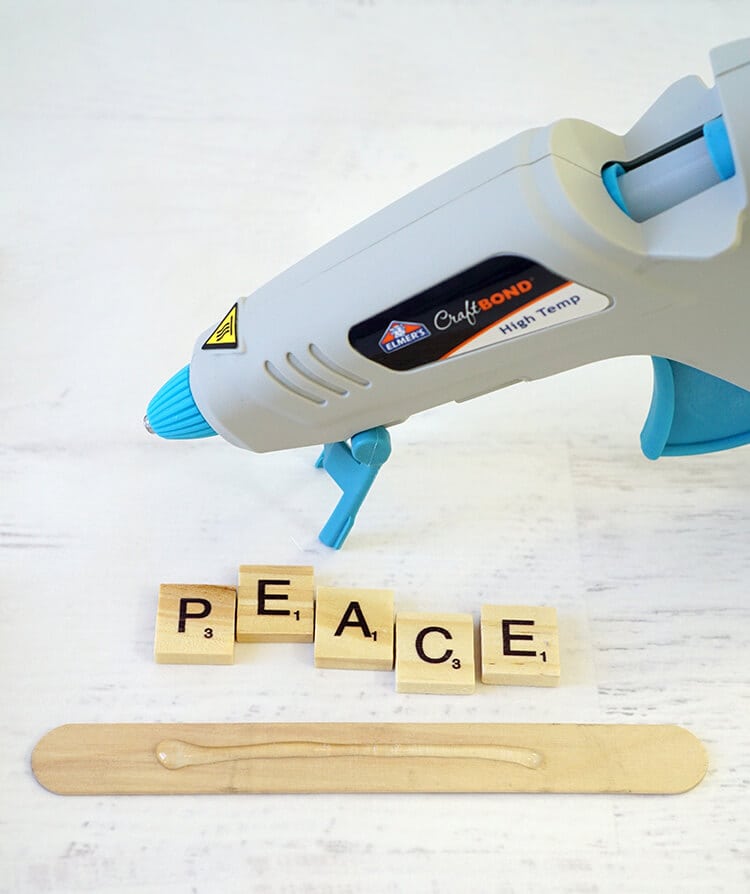 gluing scrabble letters to craft stick
