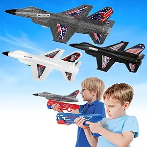 two boys playing with foam airplane launch toys