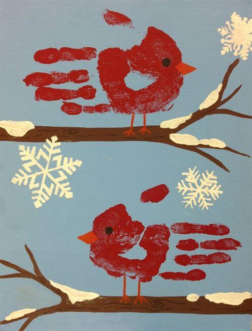 cardinal handprints with snowflakes 