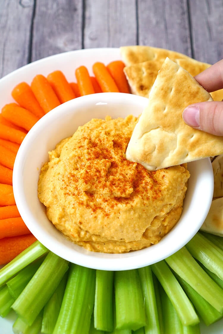 healthy red pepper lentil hummus and pita chips 