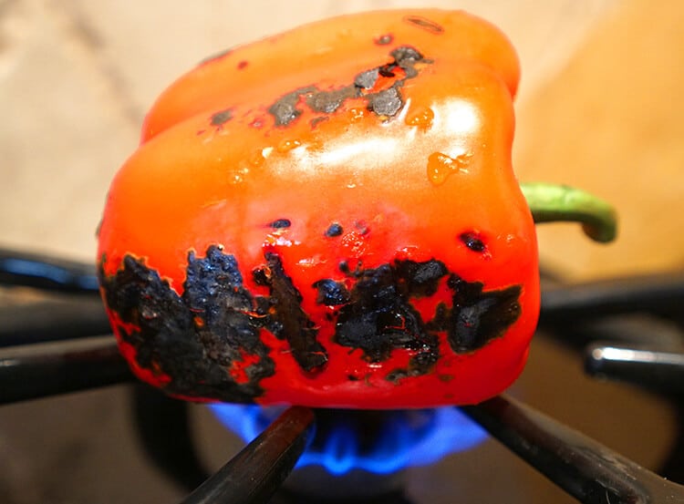 roasting a red pepper on stove top