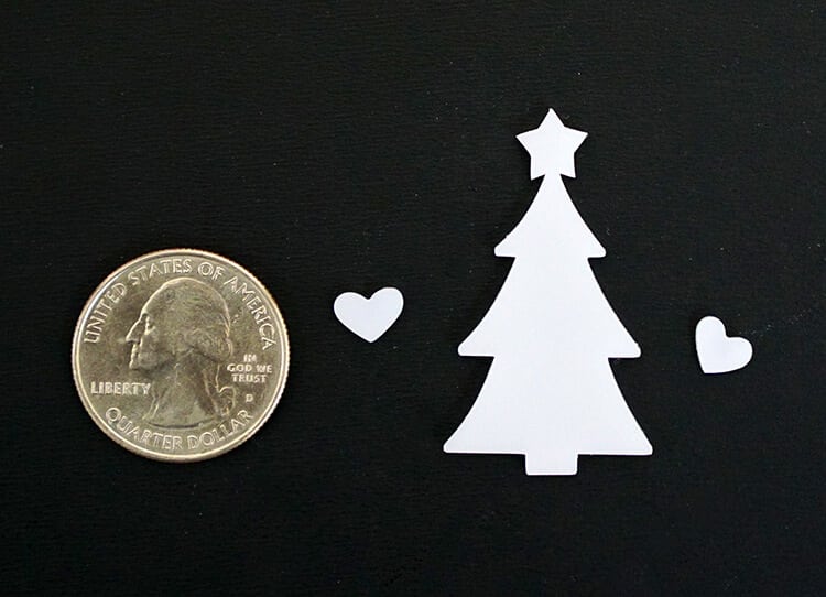 shrinky dink Christmas tree next to quarter for size