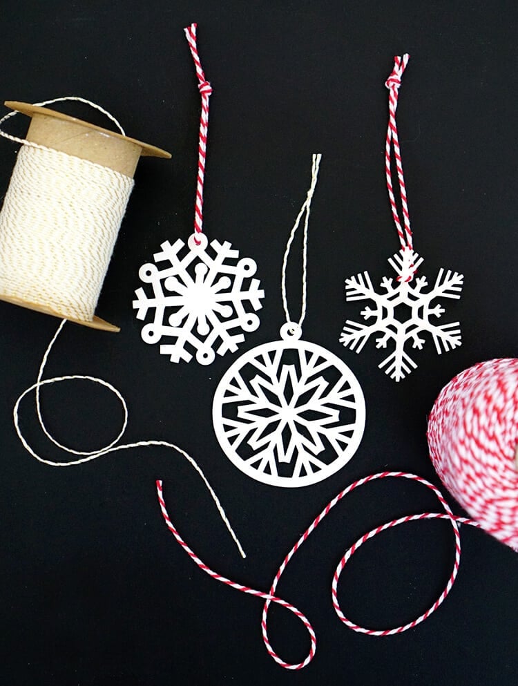 Shrinky dink snowflake ornaments and string